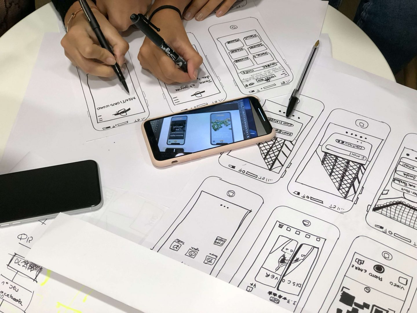 Designing often starts with a piece of paper and a pen to draw initial wireframes of the project.